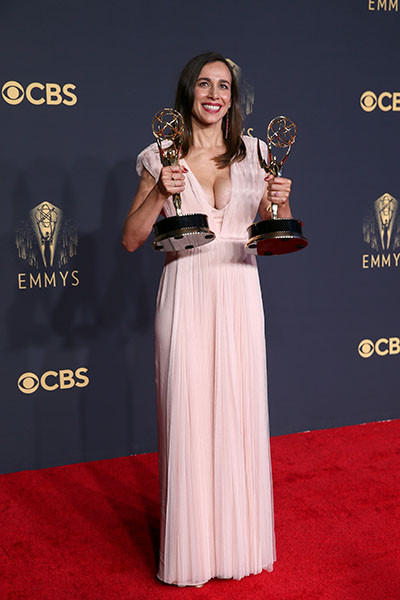 Lucia Aniello poses with awards at the 73rd Emmy Awards, September 19, 2021 in Los Angeles, California.