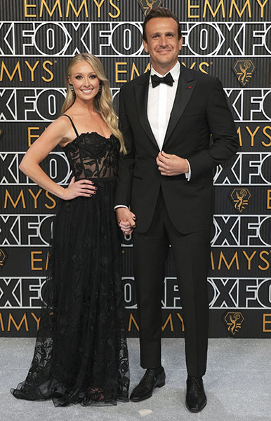Kayla Radomski and Jason Segel from Shrinking on the red carpet at the 75th Emmy Awards
