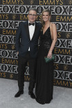 John Oliver from Last Week Tonight With John Oliver and Kate Norley on the red carpet at the 75th Emmy Awards