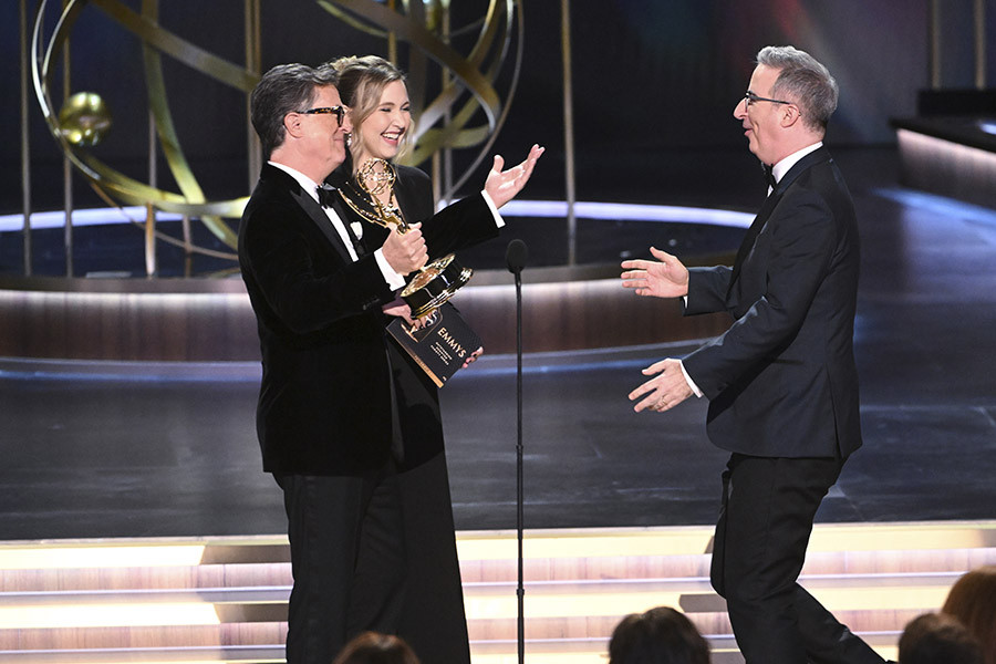 Taylor Tomlinson, Stephen Colbert, and John Oliver onstage at the 75th Emmy Awards 