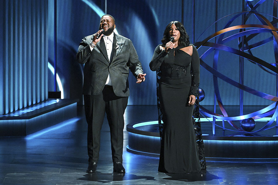 Michael Trotter Jr. and Tanya Trotter on stage at the 75th Emmy Awards
