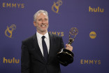 Jon Stewart backstage with his award for Outstanding Talk Series for The Daily Show at the 76th Emmy Awards