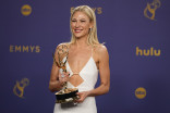 Desi Lydic of The Daily Show backstage with the award for Outstanding Talk Series at the 76th Emmy Awards