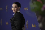 Emily Hampshire on the red carpet at the 76th Emmy Awards