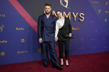 Bobby Berk of Queer Eye and Emily Hampshire on the red carpet at the 76th Emmy Awards 