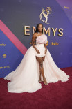 Aja Naomi King of Lessons In Chemistry on the red carpet at the 76th Emmy Awards