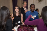 Rachel Pierce and Buki Elegbede chat with friends at the New York Networking Night Out, November 13, 2015 at the St. Regis in New York City.