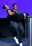 Host Anthony Anderson carries presenter Tichina Arnold on stage at the 38th College Television Awards presented by the Television Academy Foundation at the Saban Media Center on Wednesday, May 24, 2017, in the NoHo Arts District in Los Angeles. 