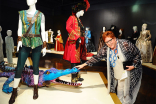 Television Academy governor Sue Bub meets a croc from Peter Pan Live! at The 9th Annual Outstanding Art of Television Costume Design Exhibition at the FIDM Museum &amp; Galleries, Saturday, July 18, 2015, in Los Angeles. 
