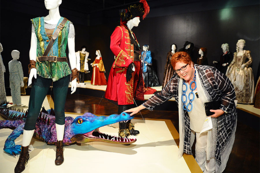 Television Academy governor Sue Bub meets a croc from Peter Pan Live! at The 9th Annual Outstanding Art of Television Costume Design Exhibition at the FIDM Museum &amp; Galleries, Saturday, July 18, 2015, in Los Angeles. 