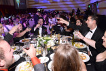 Guests toast at the 67th Los Angeles Area Emmy Awards July 25, 2015, at the Skirball Cultural Center in Los Angeles, California.